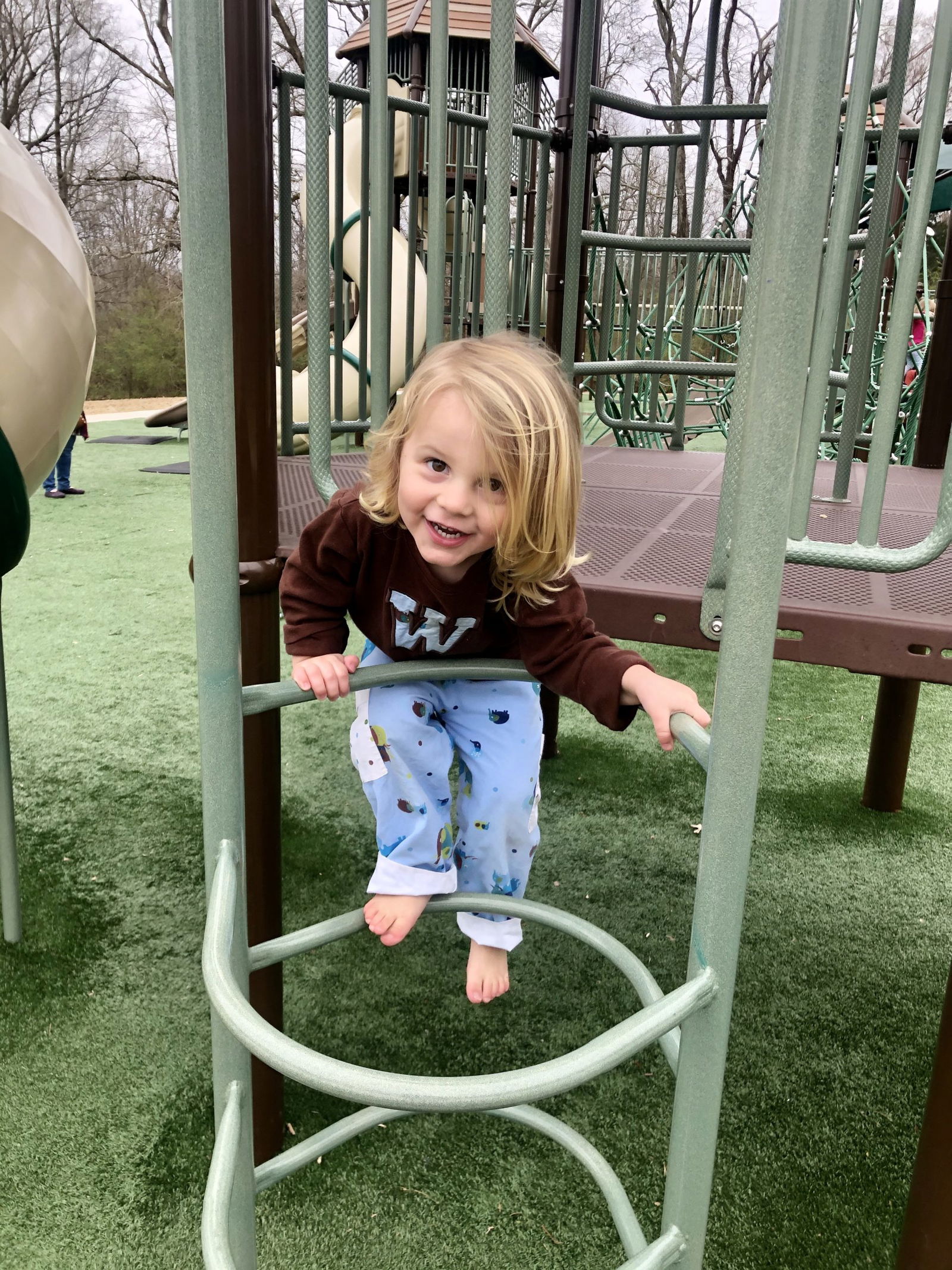 child playing outside on a playground