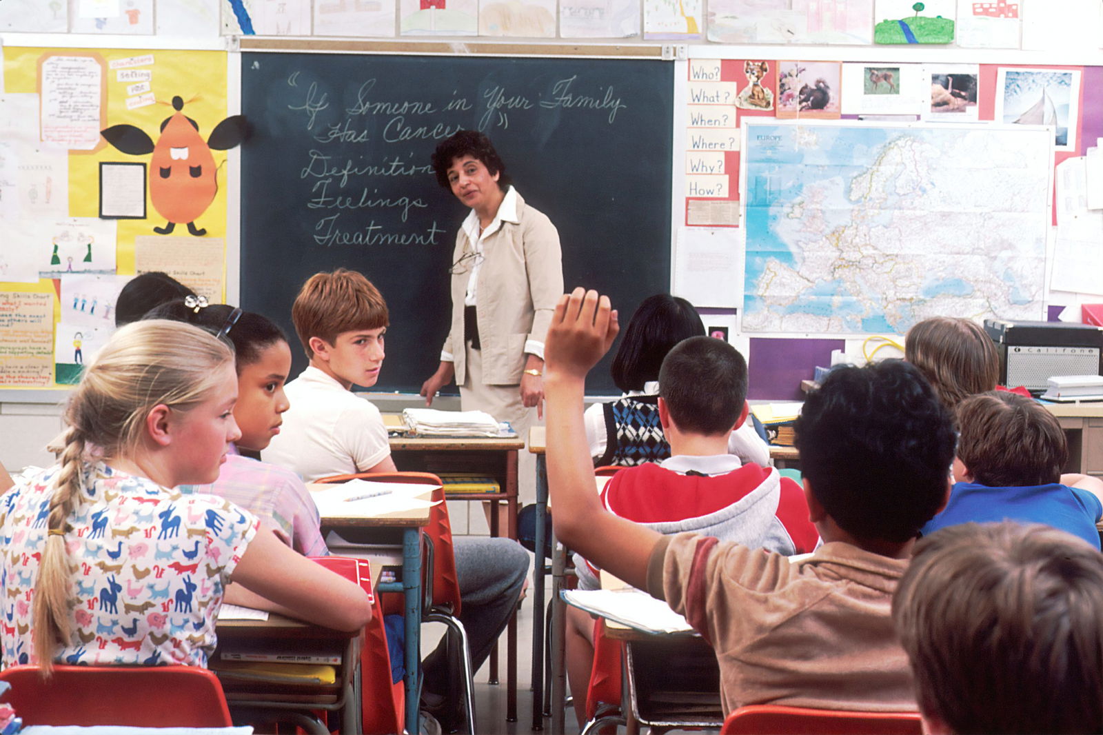 teacher with students in a classroom