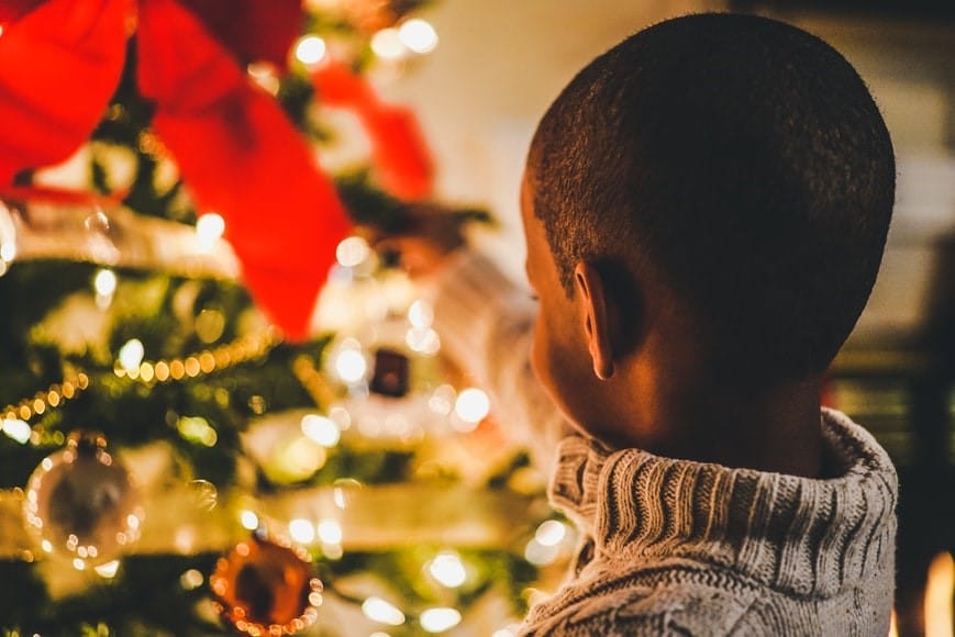 boy decorating the tree