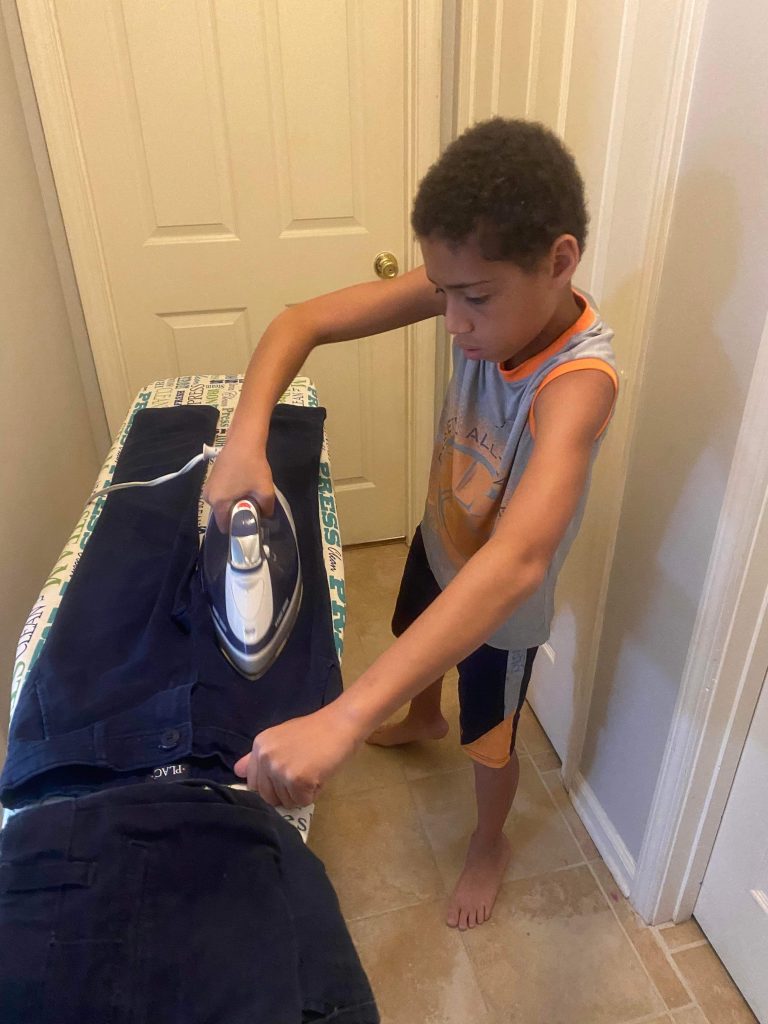 boy ironing his pants