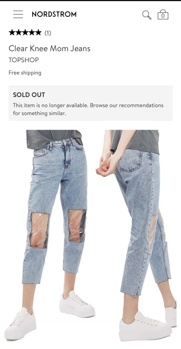 sold out jeans with a clear plastic knee covering 