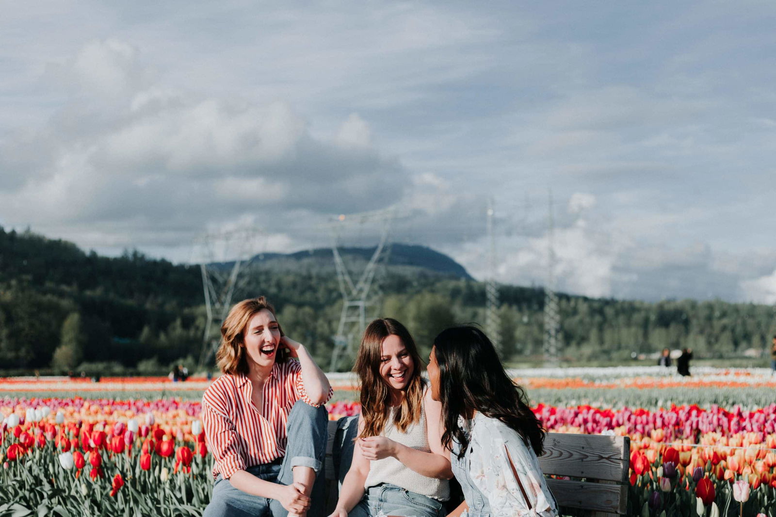 Three friends together celebrating their long distance friendships