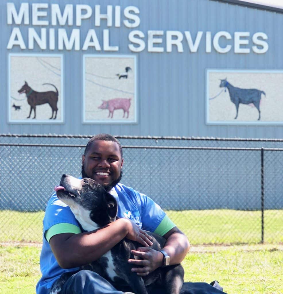 Memphis Animal Services building with a man and dog out front