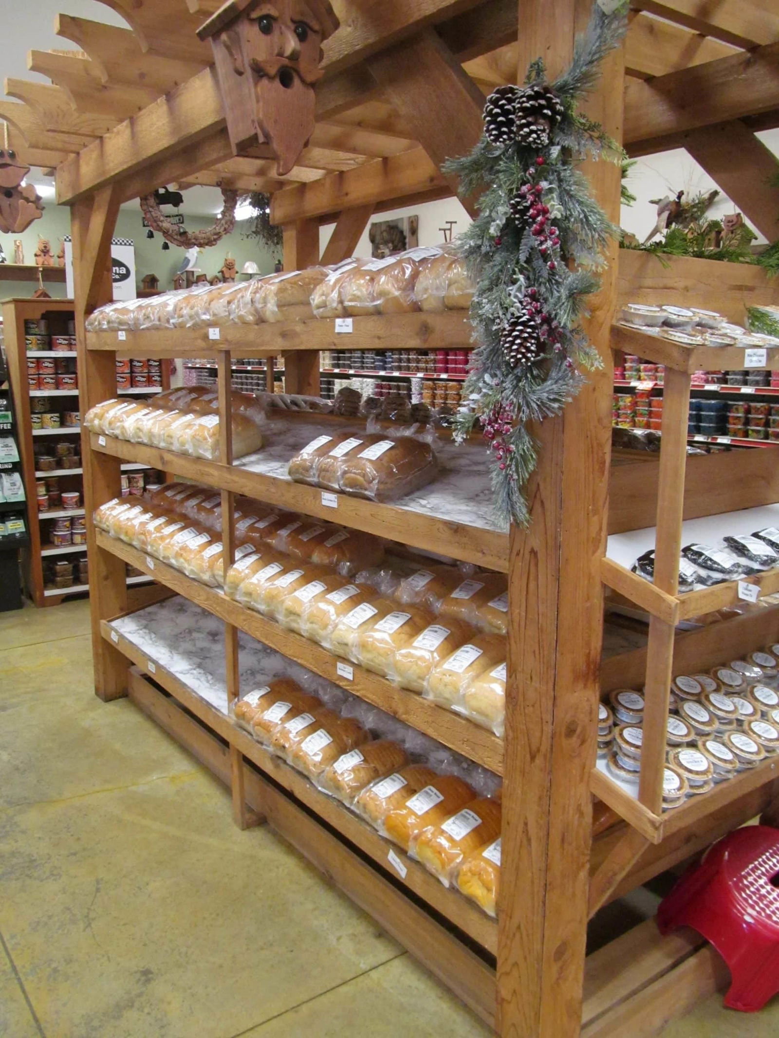 Image of a wooden rack with loaves of bread on it