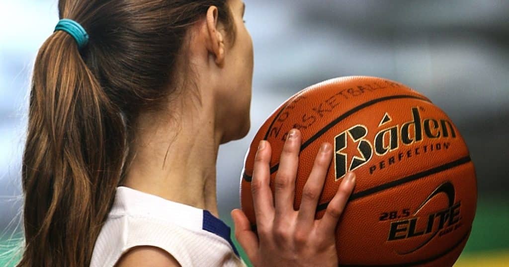 mom holding a basketball