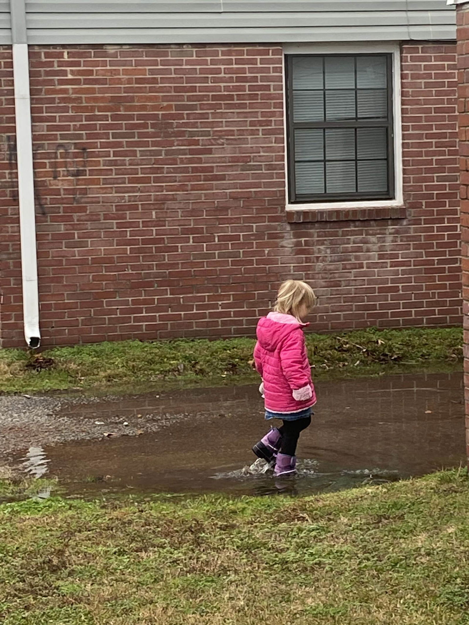 Jumping in puddles outdoors