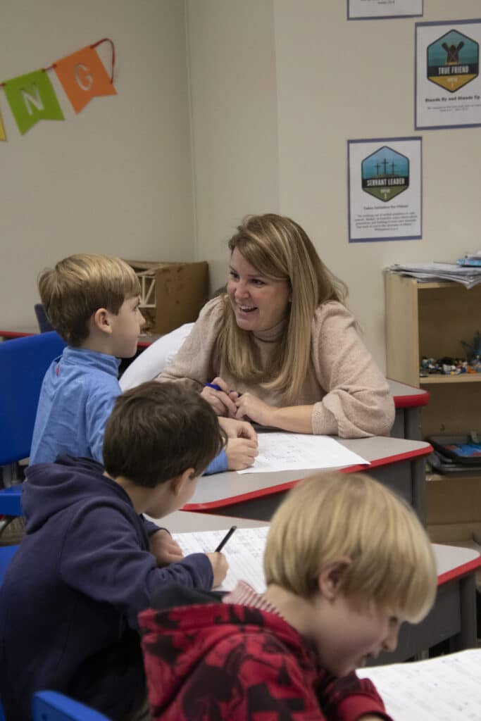 boy in classroom with their teacher