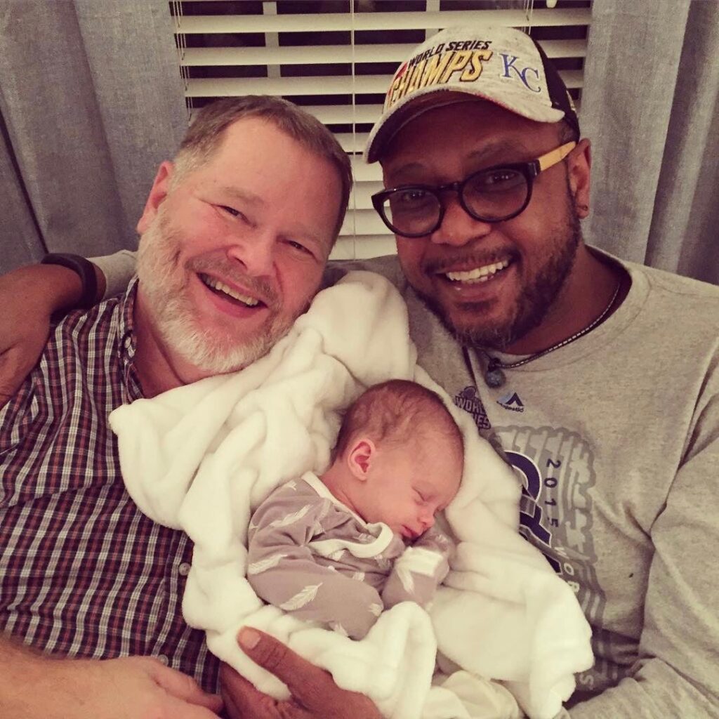 my two dads with a baby