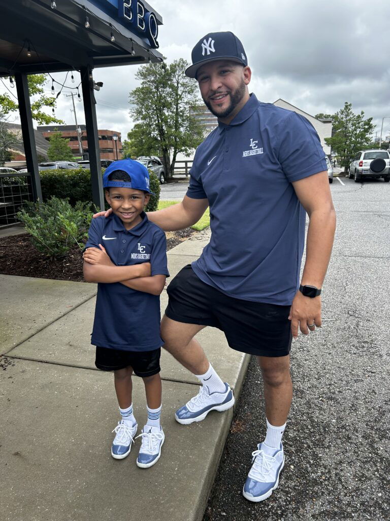 A moment of father and son bonding as my husband and son leave Central BBQ in Memphis illustrating the importance of the father-son relationship shift.