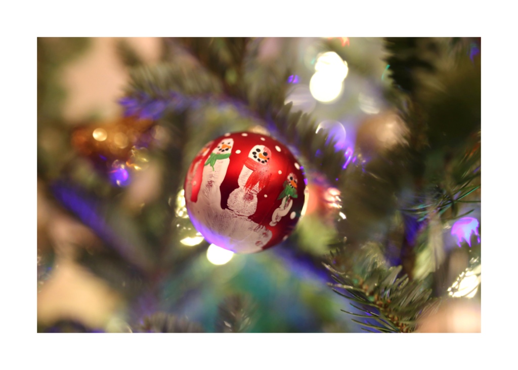 kids homemade hand-print ornament to simplify gift-giving 