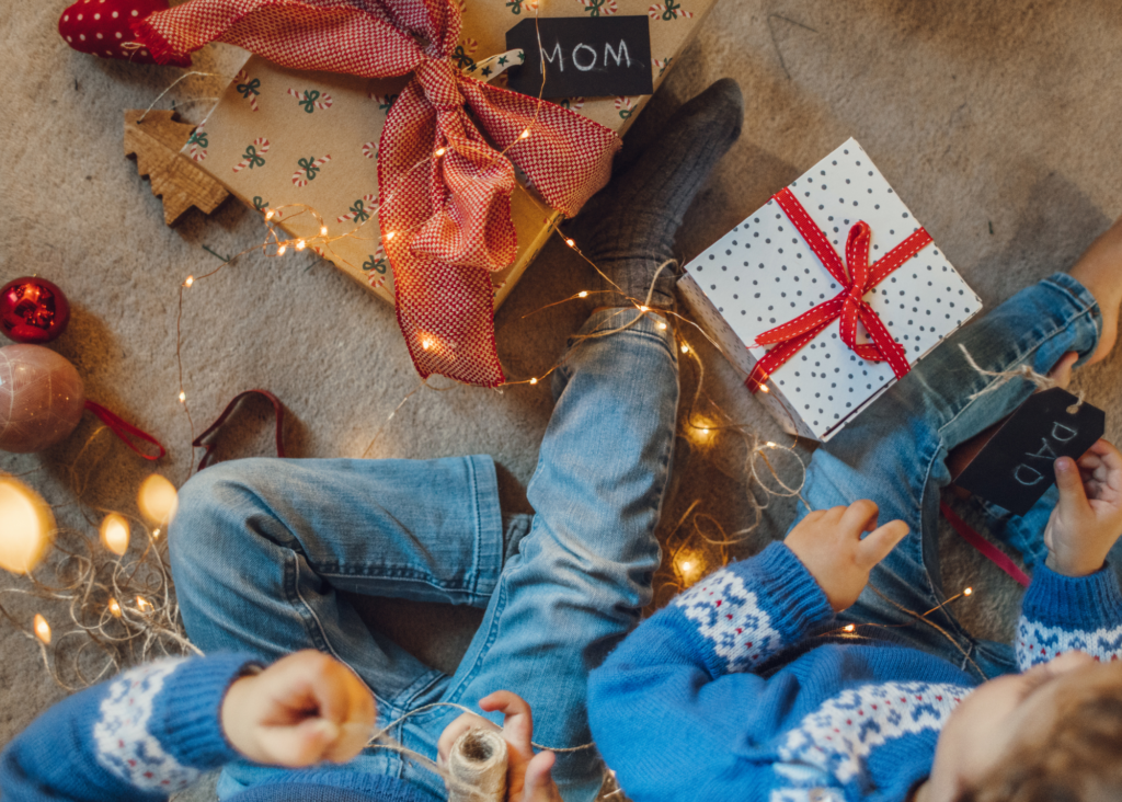 Kids wrapping holiday gifts to "share the load"