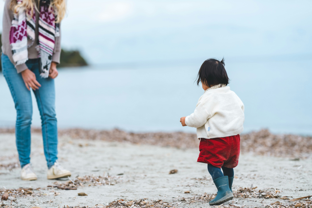 child walking to her mom