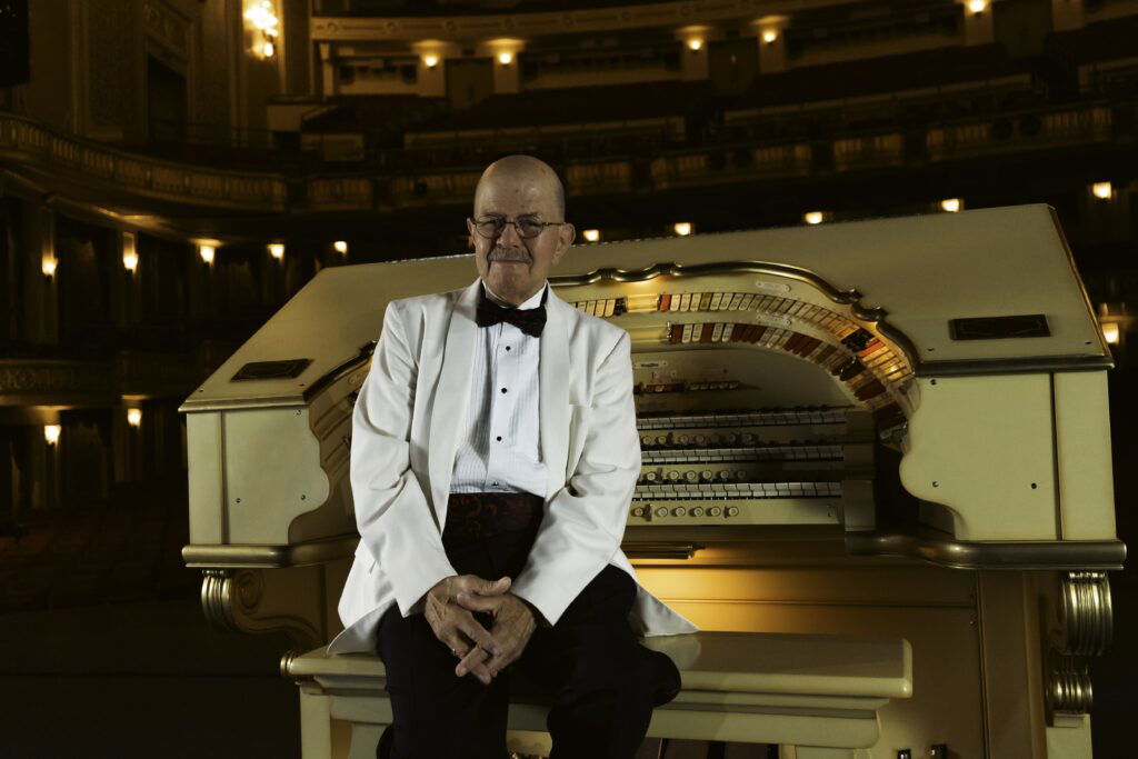 Organist of the Orpheum Theater sitting at the organ