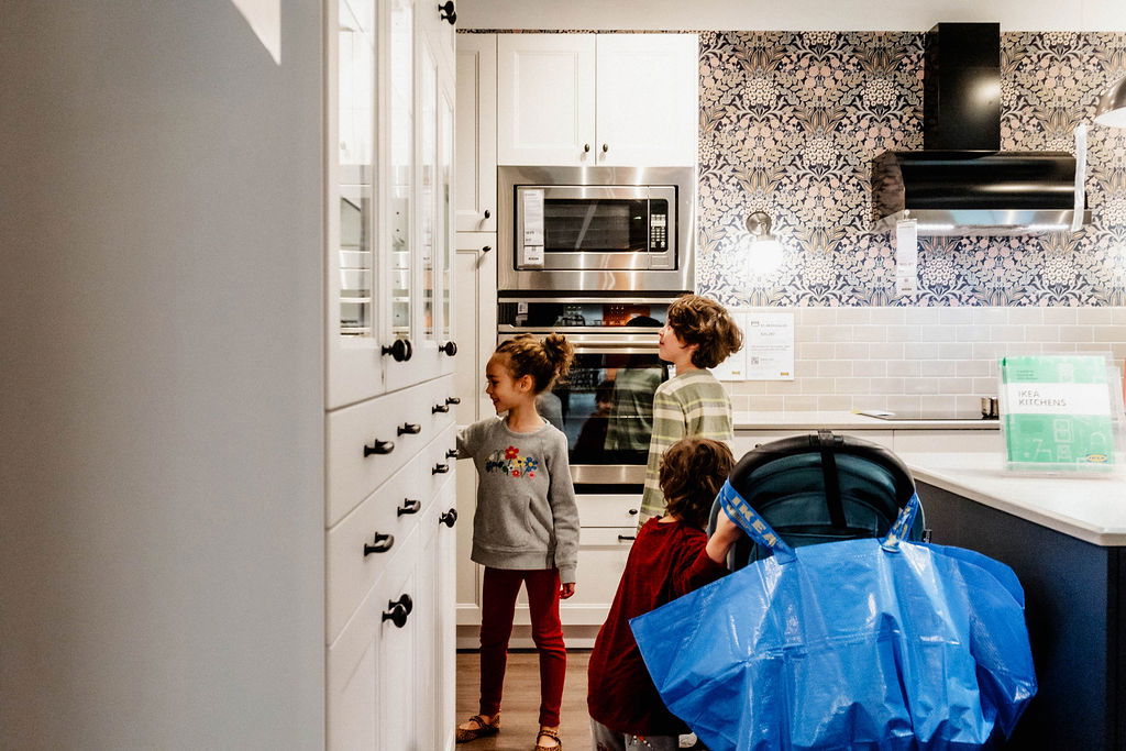 kids in a kitchen at Ikea 